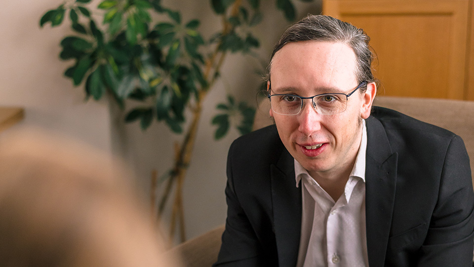 Chris listening to a client